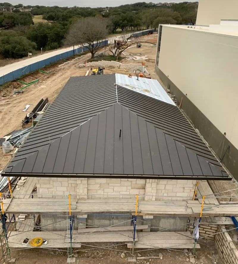 Metal roof new construction with scaffolding in Commerce
